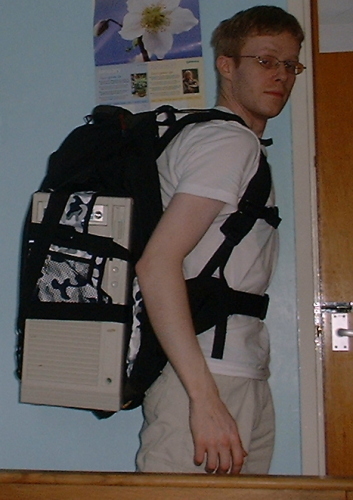 A picture of me in shorts and t-shirt with the burden perched on my pack